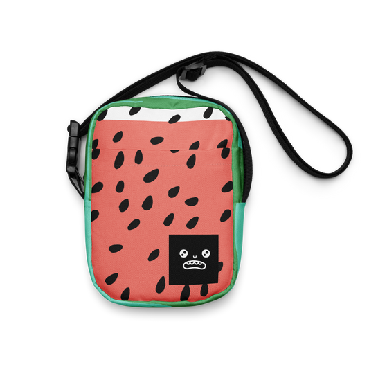 Mini crossbody bag with a watermelon print, black seed details, green edges, and a cartoon face on the front – fun and quirky design.