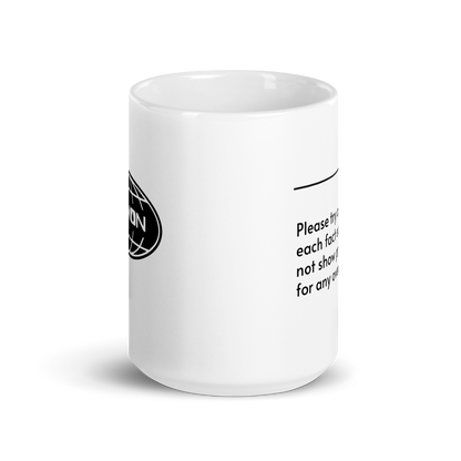 White ceramic mug with a humorous quote: "Please try and enjoy each fact equally, and not show preference for any over the others."